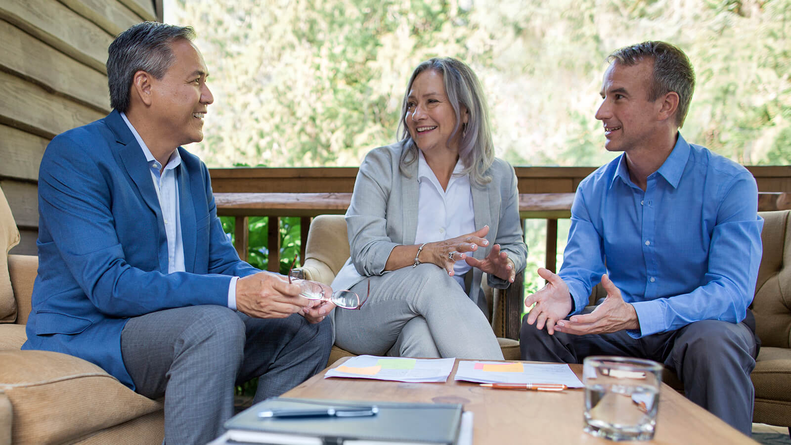 A husband and wife in their late 50s meet with their financial professional to discuss retirement strategies, including asking what is a market value adjustment?