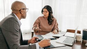 A financial professional and his client discuss the benefits of financial planning to help plan her future.