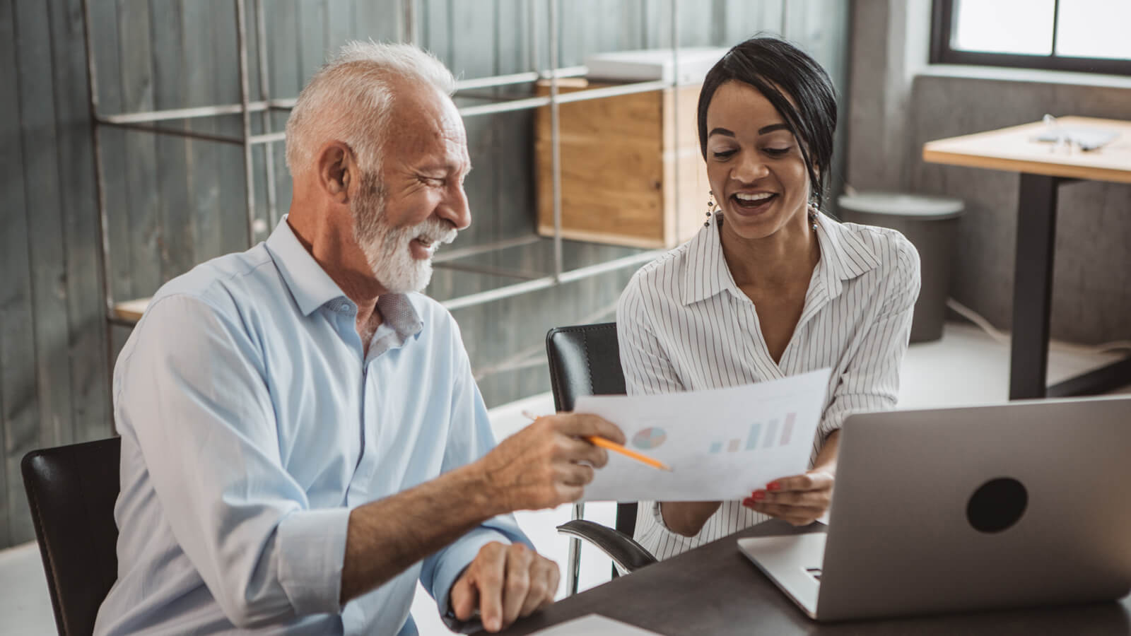 A financial professional meets with his plan sponsor client to share the 2025 cost of living adjustment and discuss the impact of retirement contributions and plan strategy.