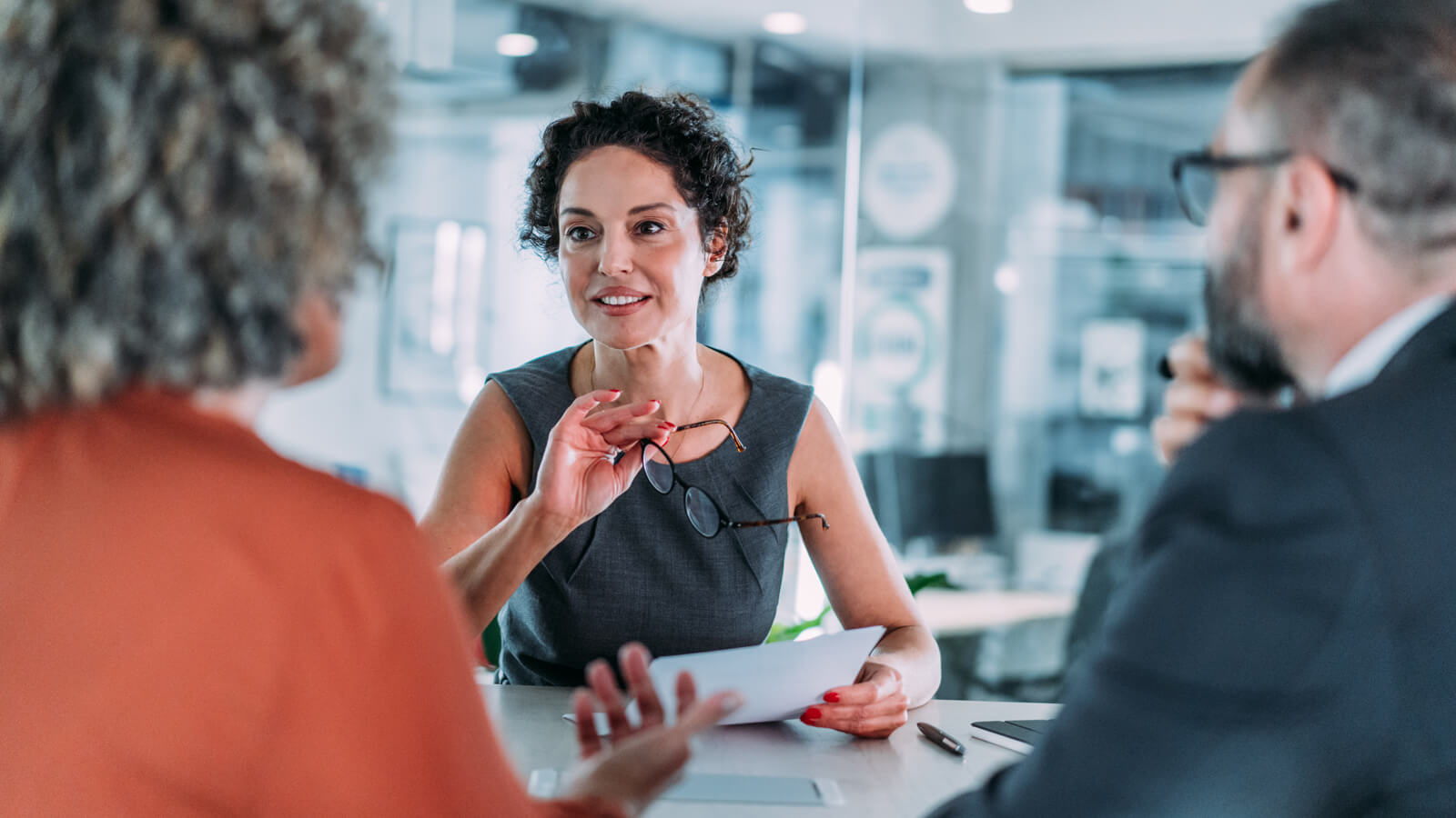 A financial professional meets with her clients to discuss how they can use life insurance to help with their retirement funding.